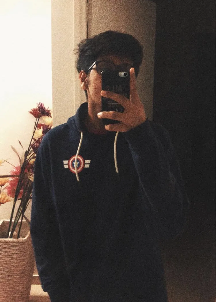 Rushil Choksi taking a mirror photograph.